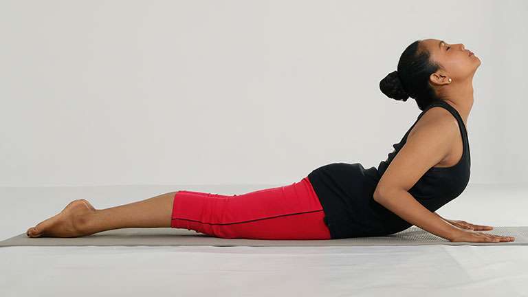 Beautiful woman do Yoga Bhujangasana Cobra Pose stretching posture at home  Stock Photo - Alamy