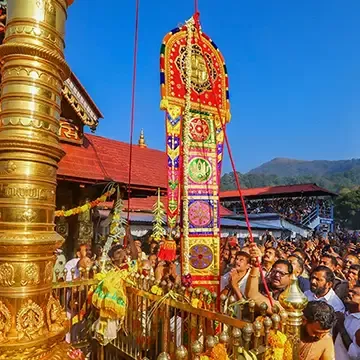 The flag hoisting ceremony of the ten day long annual festival at Sabarimala Temple