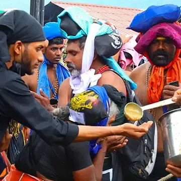 Devotees distributing payasam (kheer) prasadam at sabarimala Temple